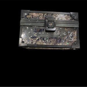 Vintage mini Caboodle, clear with black trim and holographic stars.